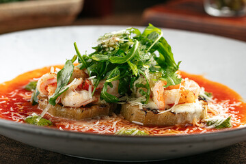 Closeup on gourmet grilled eggplant with shrimp and cheese