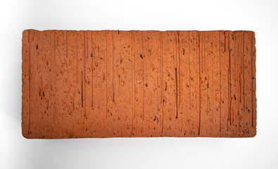 Rectangular orange brick on white isolate. Building bricks on a white background.Place for the inscription. Construction company. Photo of a brick.
