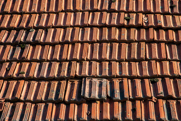 Old rural country house ceramic tiled top roof closeup