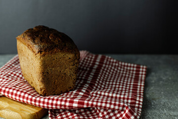 black malt rye bread on a checkered tablecloth