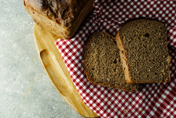 black malt rye bread on a checkered tablecloth