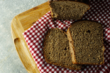 black malt rye bread on a checkered tablecloth