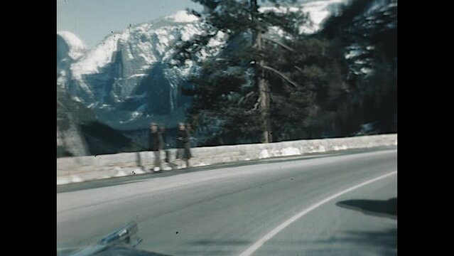 Yosemite Valley Travel 1955 - POV of driving through Yosemite National Park with a view of El Capitan and Half Dome in the snow  