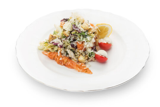 Salad, red fish on a plate, Ukrainian cuisine. Photo of food on a white background