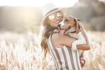 Attractiive young woman outdoors with her pet. Owner and dog together. Friends forever. Lady and...