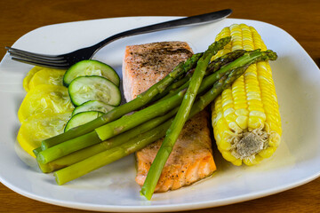 baked salmon season with salt and pepper with vegetables