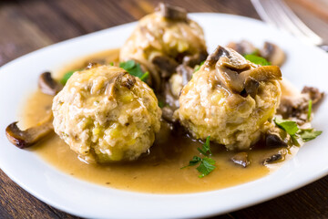 meat and potato balls in mushroom sauce