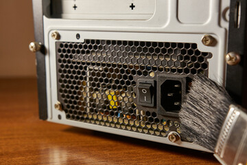 Dust contamination of the computer case grille. PC care and cleaning.