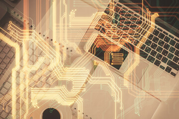 Technology hologram drawing over computer on the desktop background. Top view. Double exposure. Tech concept.