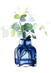 Twig with leaves in a blue glass vase on a white background.Idea for decorating home,restaurant,cafe.