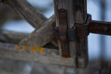 old rusty wrought iron locks and trim forged by a blacksmith on an old wooden gate