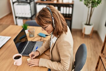 Young caucasian call center agent woman smiling happy working at the office.