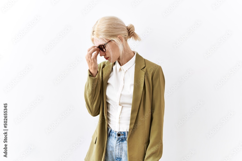 Canvas Prints Beautiful caucasian business woman standing over isolated background tired rubbing nose and eyes feeling fatigue and headache. stress and frustration concept.