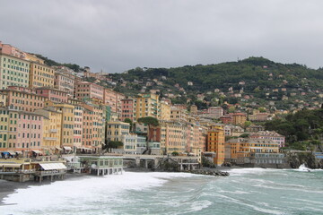 City of Camogli | Fishing village and tourist resort located on the west side of the peninsula of Portofino | Stormy sea with view of the main promenade