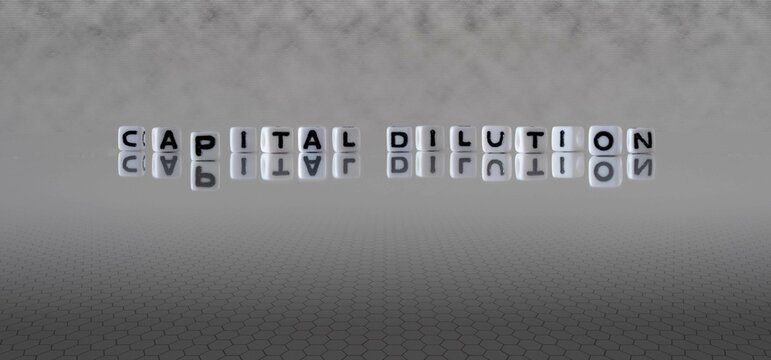capital dilution word or concept represented by black and white letter cubes on a grey horizon background stretching to infinity