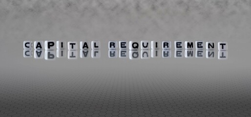 capital requirement word or concept represented by black and white letter cubes on a grey horizon background stretching to infinity - obrazy, fototapety, plakaty