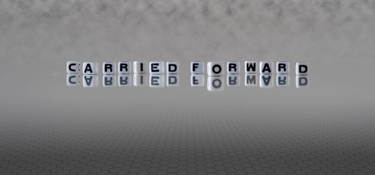 carried forward word or concept represented by black and white letter cubes on a grey horizon background stretching to infinity