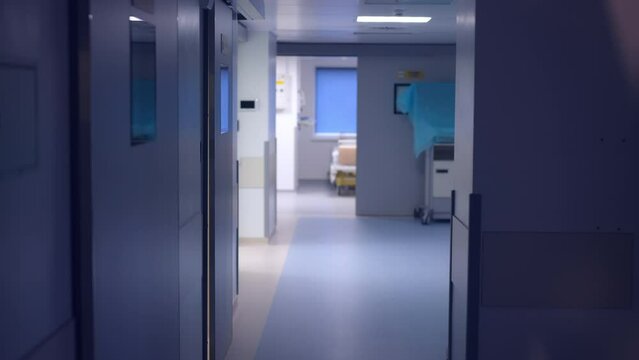 Interiors of modern medical clinic hallway with no people. Wide shot hospital corridor indoors. Medicine and health care concept