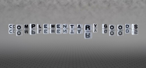 complementary goods word or concept represented by black and white letter cubes on a grey horizon...