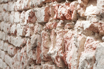 Ancient fortress wall made of light yellow stone
