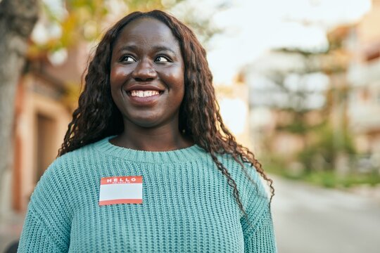 Young African Woman Smiling Happy Wearing Hello I Am Sticker At The City