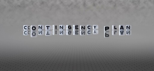 contingency plan word or concept represented by black and white letter cubes on a grey horizon background stretching to infinity