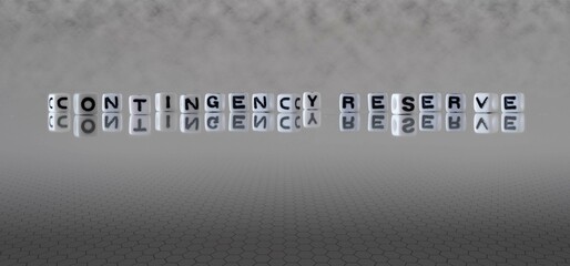 contingency reserve word or concept represented by black and white letter cubes on a grey horizon background stretching to infinity - obrazy, fototapety, plakaty