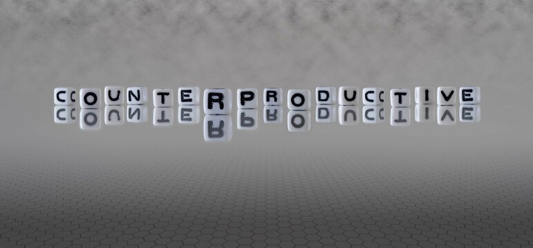 counterproductive word or concept represented by black and white letter cubes on a grey horizon background stretching to infinity