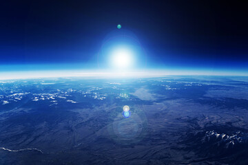 Sunrise over the planet from space. Elements of this image furnished by NASA