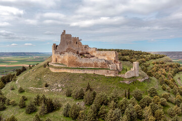Fototapeta na wymiar A prominent castle in ruins up on the hill - Castrojeriz, Castile and Leon, Spain