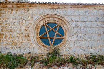Church of San Juan in Castrojeriz Burgos dating from the thirteenth century. Rosette superb specimen of pentagram pentagon traditionally invested mystical symbolism.
