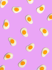 Creative Easter eggs on pastel light pink background. Minimalistic breakfast concept. Holiday contemporary inspiration.