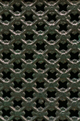 Curly green metal grate background