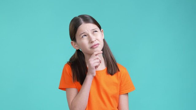 Smart schoolkid ponder decide dilemma great mind isolated cyan color background