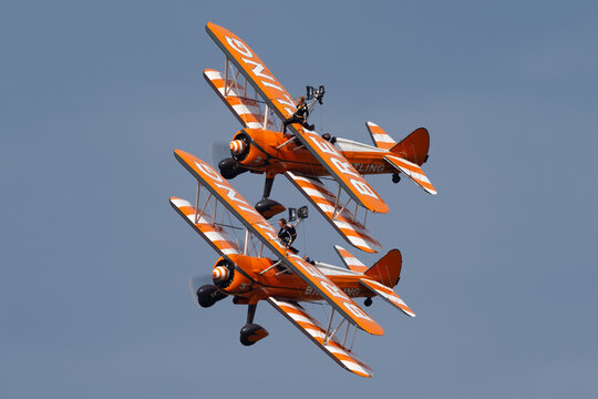 Payerne, Switzerland - August 29, 2014: Breitling Wing Walkers Barnstorming Flying Display In Vintage Boeing Stearman Biplanes.