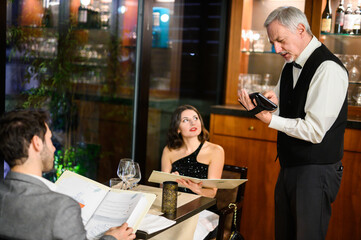 Waiter taking orders in a restaurant