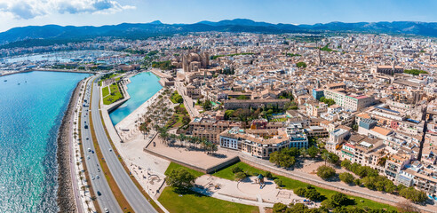 Aerial view of the highway near Palma de Mallorca and the beach in Spain. Road goes into the capital.