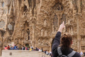 Tourist pointing to the Sagrada Familia, Barcelona, Spain
