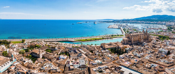 Aerial view of the capital of Mallorca - Palma de Mallorca in Spain. A touristic city by the sea. - obrazy, fototapety, plakaty