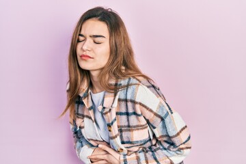 Fototapeta premium Young caucasian girl wearing casual clothes with hand on stomach because indigestion, painful illness feeling unwell. ache concept.