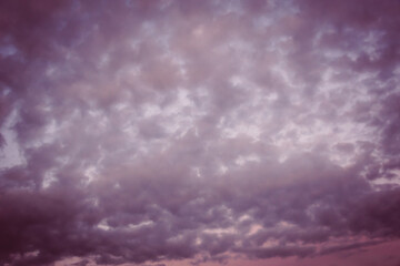 Sunset in the sky, small, wavy clouds.