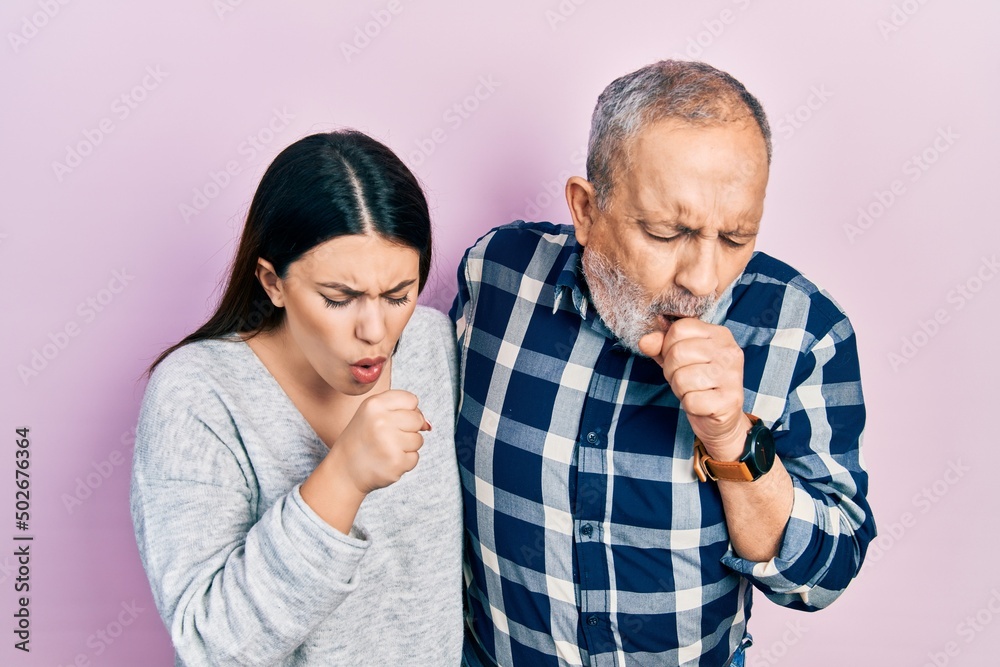 Canvas Prints Hispanic father and daughter wearing casual clothes feeling unwell and coughing as symptom for cold or bronchitis. health care concept.