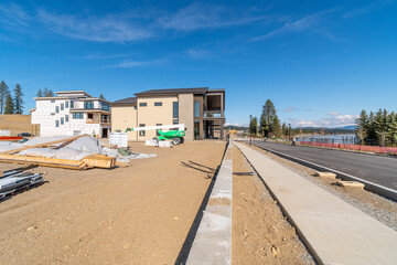 Fototapeta na wymiar New luxury waterfront homes under construction along the Spokane River in Coeur d'Alene, Idaho.