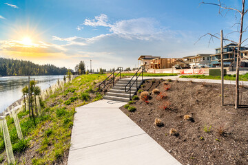 A waterfront community development under construction of new luxury homes and condos along the Spokane River in Coeur d'Alene, Idaho, USA. - obrazy, fototapety, plakaty