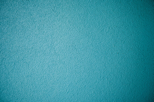 Turquoise Blue Wall Background in Sunlight.