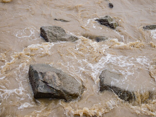 Close up shot of some waves over rocks in South China Sea