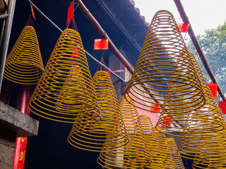 Close up shot of incense offerings in temple