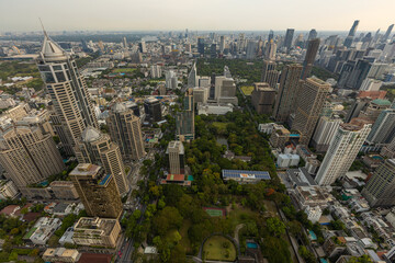 Aerial view of Ploenchit junction with cars traffic skyscraper buildings. Bangkok City in downtown at night, Thailand