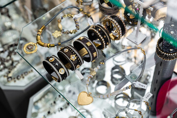 Fashionable handmade bracelets on the showcase of a jewelry store