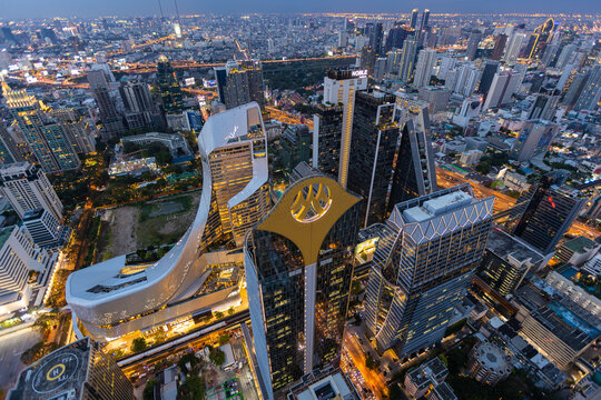 Aerial view of Ploenchit junction with cars traffic skyscraper buildings. Bangkok City in downtown at night, Thailand © Sathit